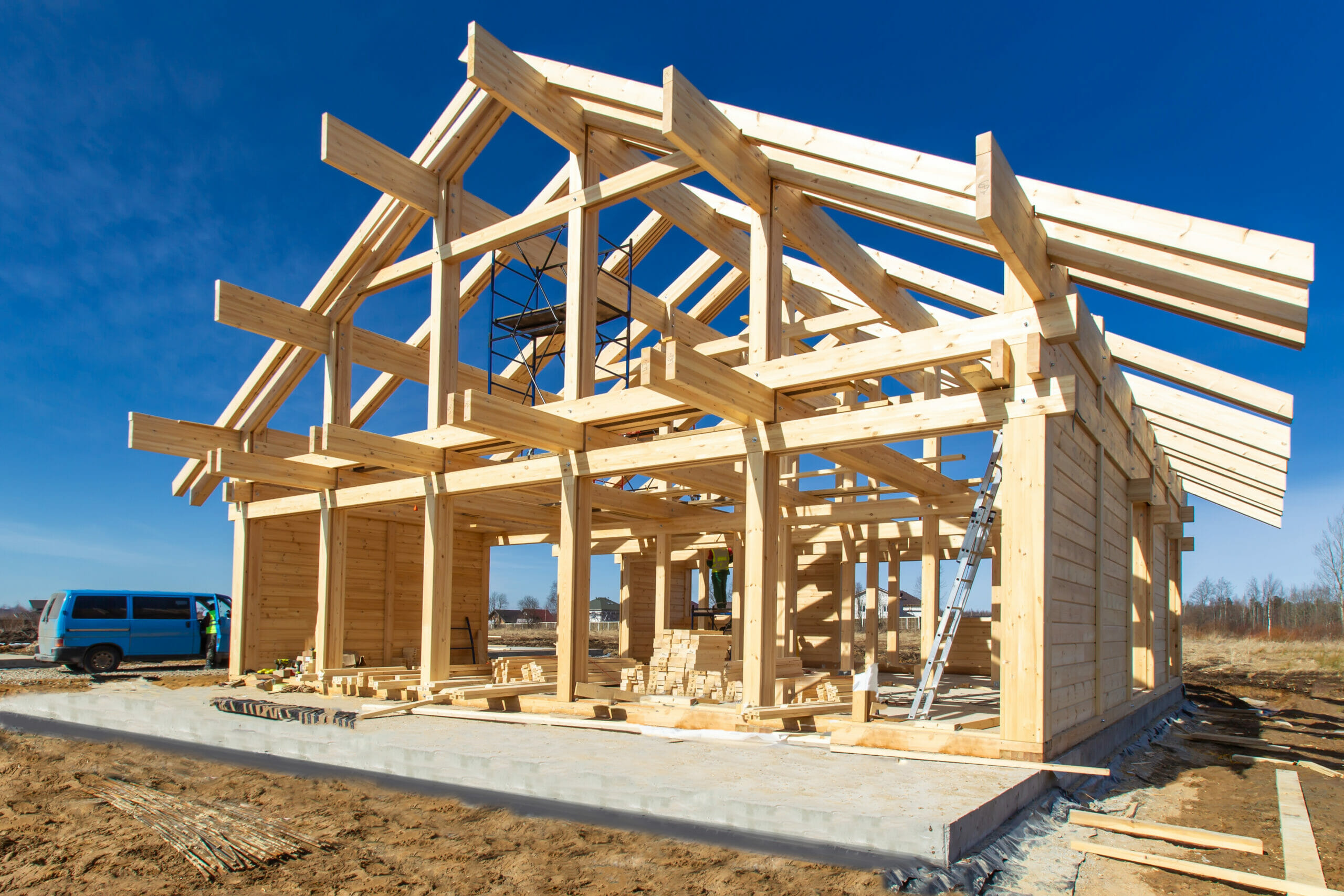 Construction of a house made of laminated veneer lumber. The frame of the house. Cottage made of laminated wood. Erection of the frame of the cottage. Manufacture of houses made of wood.